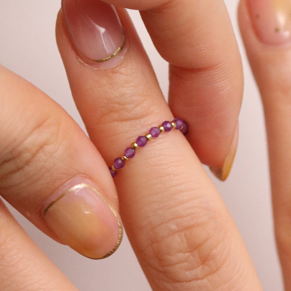 Stretchy Gemstone Ring featuring semi-precious gemstones and delicate sterling silver plated beads, offering a comfortable fit with a touch of refined elegance.