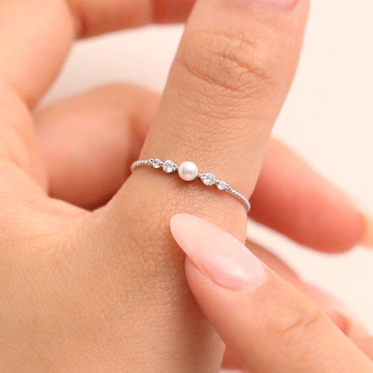 Pearl Cubic Ring featuring high-quality freshwater pearls in a unique cubic design, offering timeless elegance and sophisticated style for any occasion.