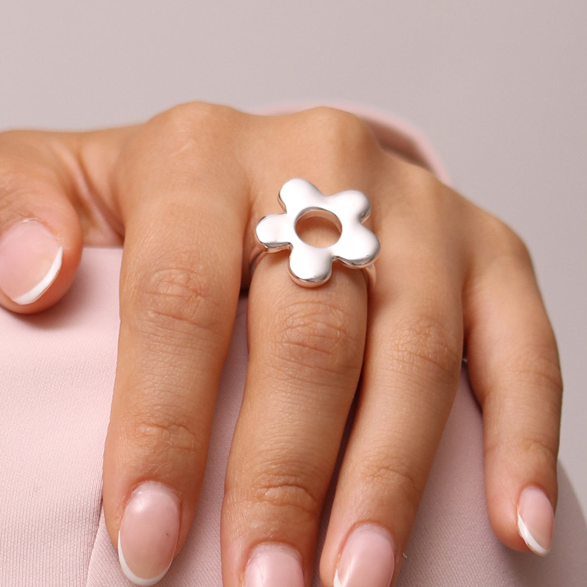 Daisy Adjustable Silver Ring crafted from high-quality silver, featuring a timeless daisy design with an adjustable fit for everyday elegance.