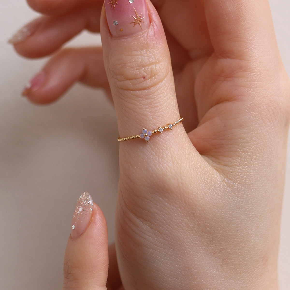 Moonstone Cubic Flower Ring handcrafted with a glowing moonstone centre and delicate cubic flower petals, blending natural beauty.