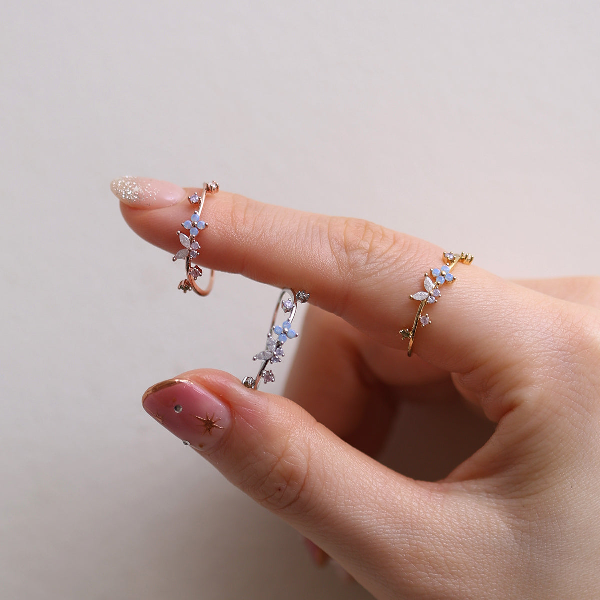 Butterfly Moonstone Flower Cubic Ring with a unique twist design and adjustable fit, combining layered elegance and modern style for any occasion.