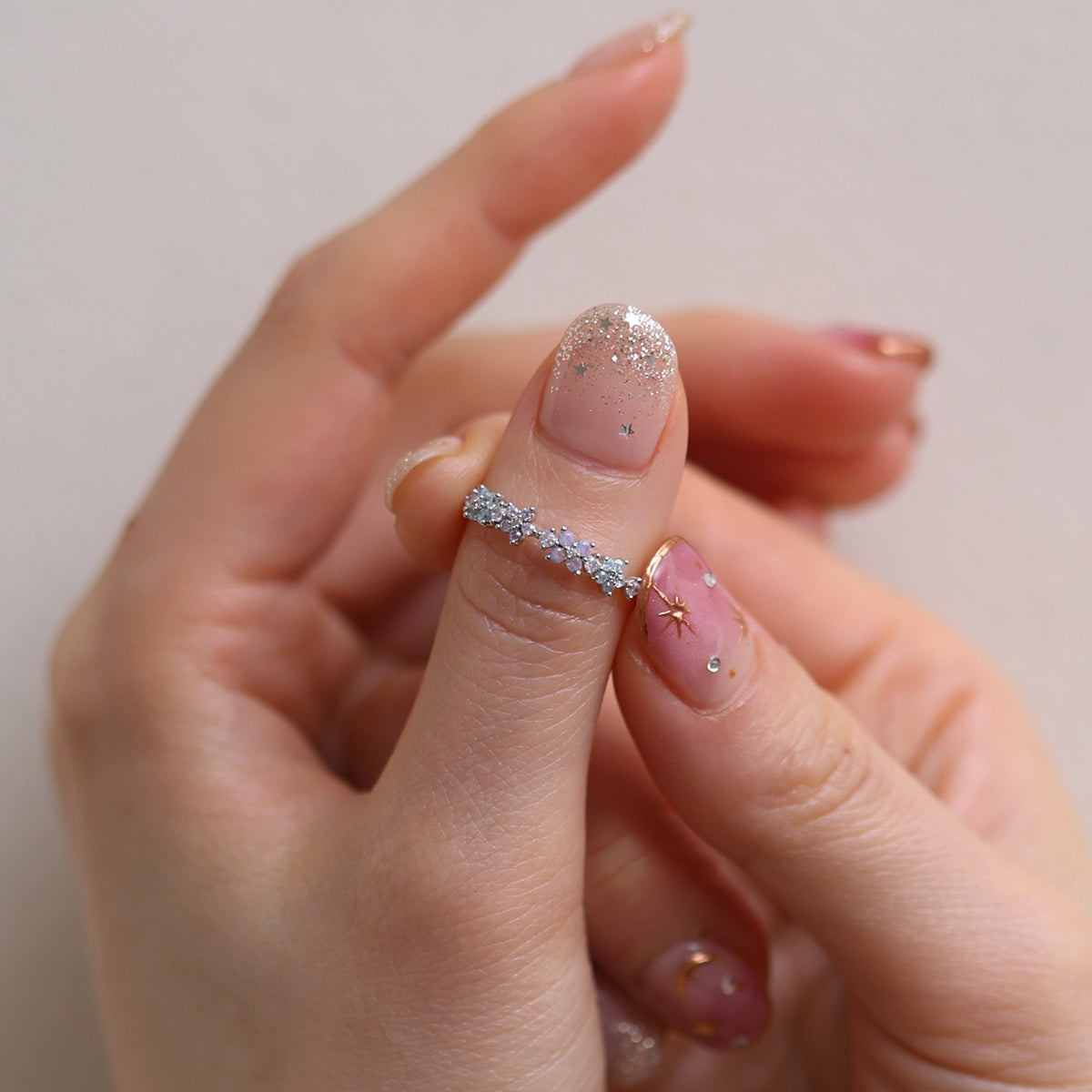 Moonstone Flower Ring featuring a radiant moonstone centre and delicate floral design, crafted from high-quality materials for a touch of timeless elegance.