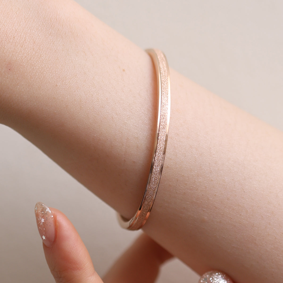 Delicate Thin Glitter Bangle featuring a subtle glitter finish for a touch of sparkle, crafted for minimalist elegance and all-day comfort—perfect worn alone or stacked.