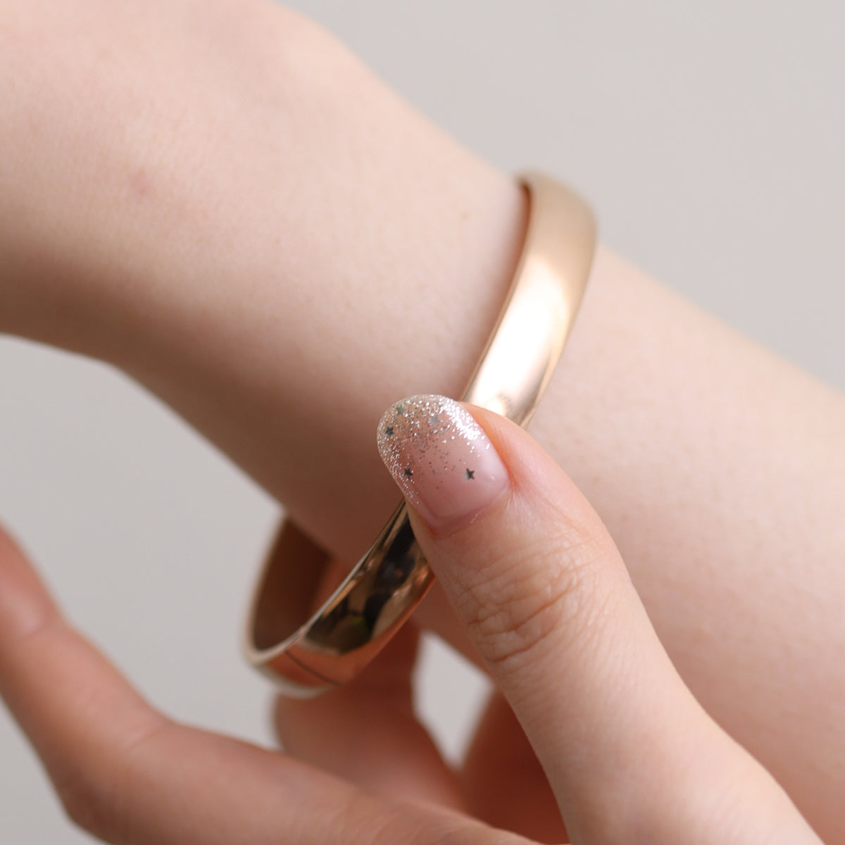 Thick Minimalist Bangle featuring clean lines and a robust profile, expertly crafted for durability and elegance—perfect for elevating both casual and formal looks.