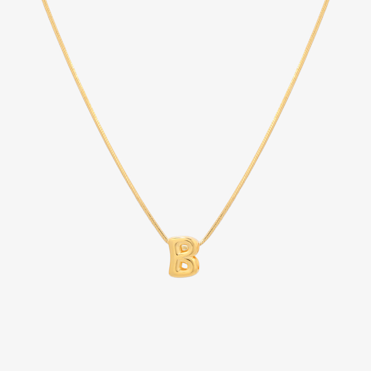 Bubble initial pendant necklace featuring a rounded, playful letter charm on a sleek snake chain, with a smooth and glossy finish.
