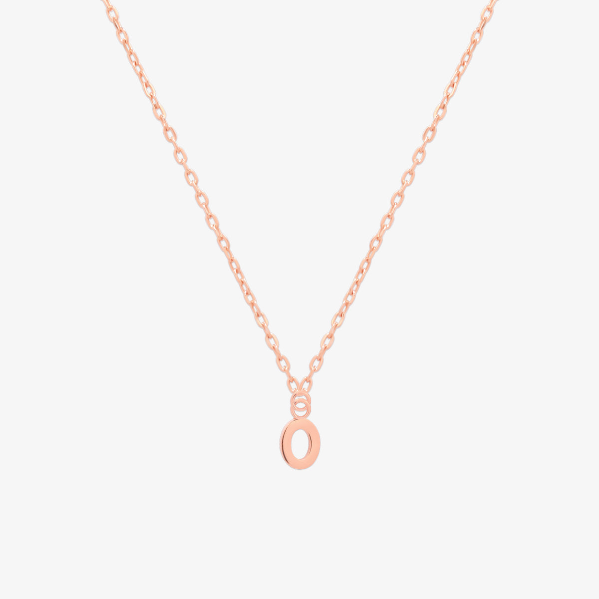 Classic initial pendant necklace featuring a polished letter charm on a delicate chain, showcasing a timeless and elegant design.