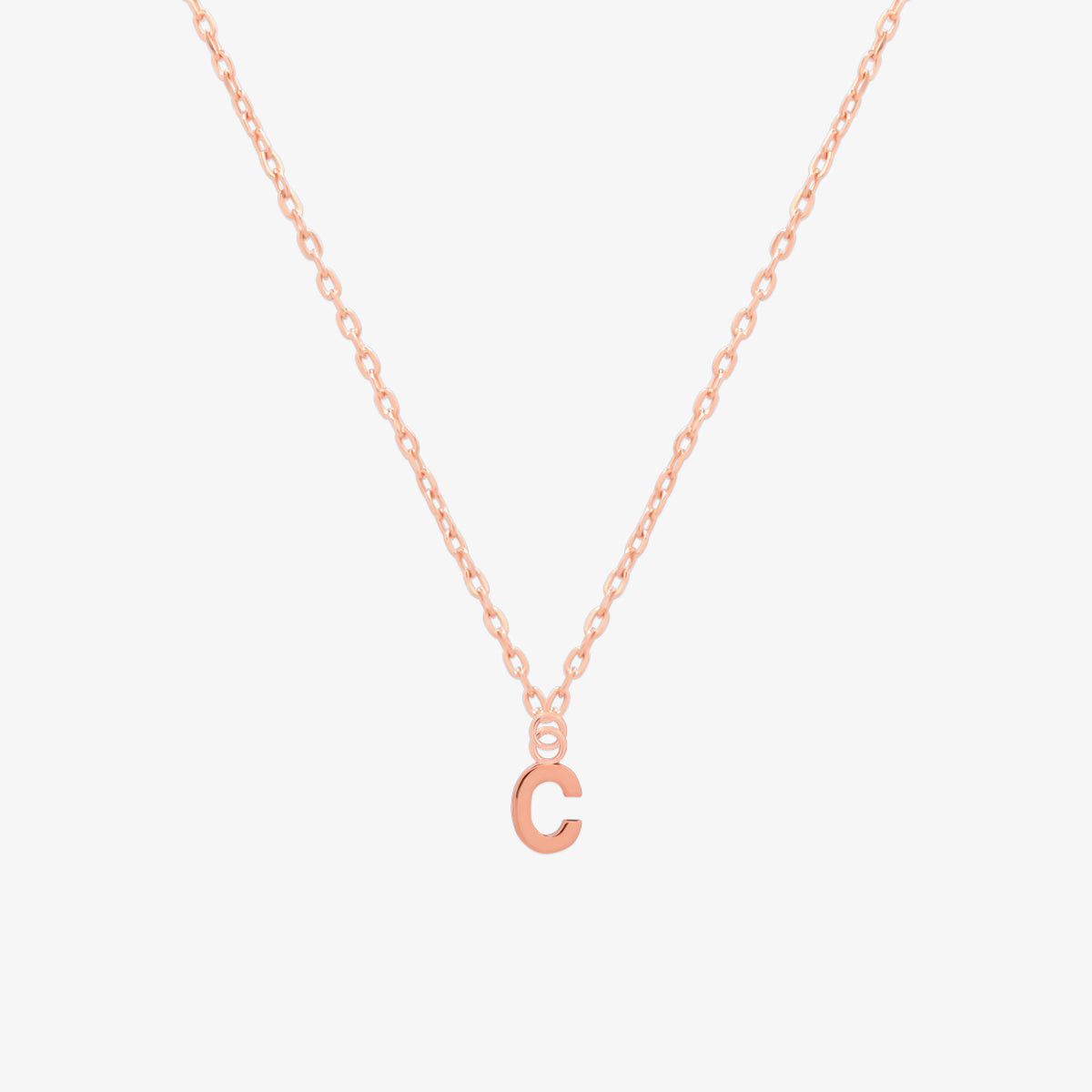 Classic initial pendant necklace featuring a polished letter charm on a delicate chain, showcasing a timeless and elegant design.