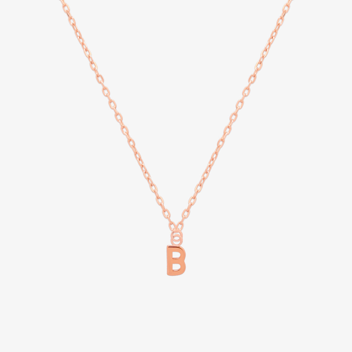Classic initial pendant necklace featuring a polished letter charm on a delicate chain, showcasing a timeless and elegant design.
