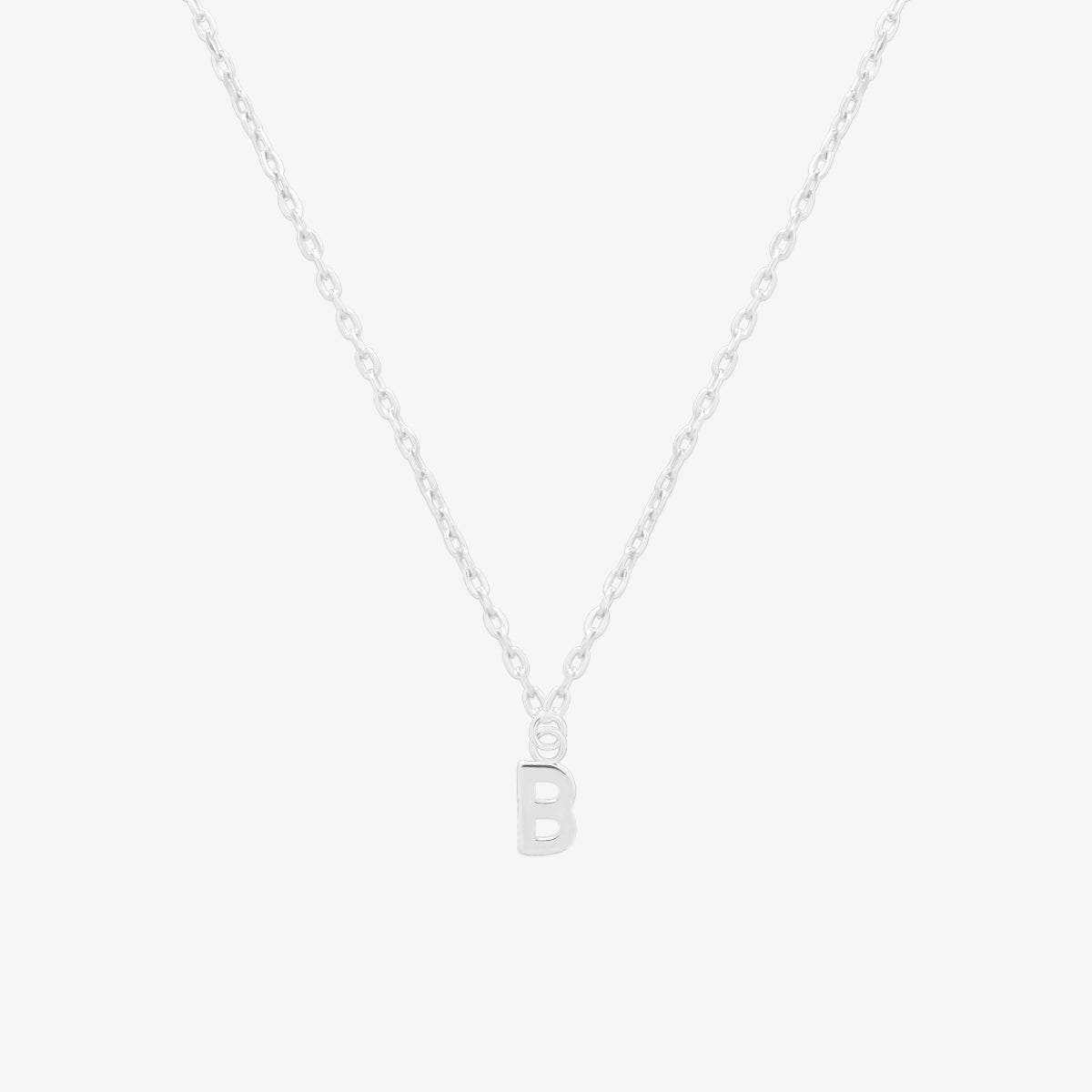Classic initial pendant necklace featuring a polished letter charm on a delicate chain, showcasing a timeless and elegant design.