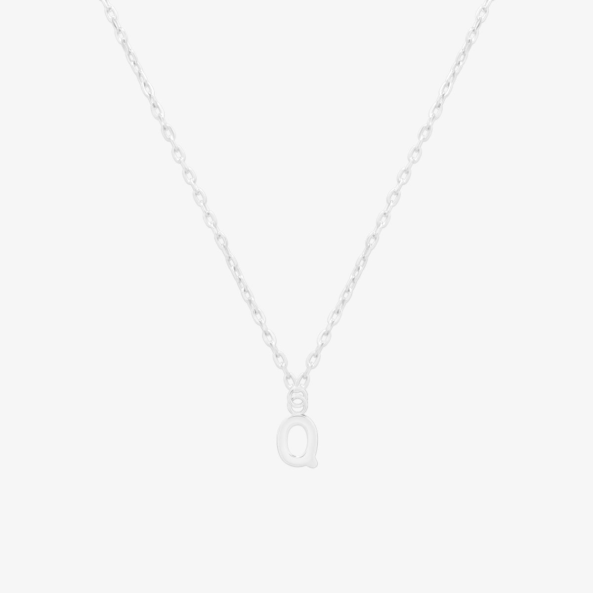 Classic initial pendant necklace featuring a polished letter charm on a delicate chain, showcasing a timeless and elegant design.