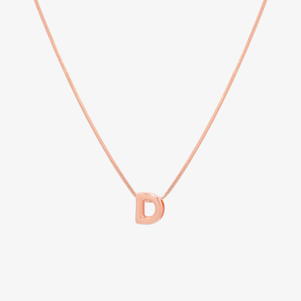Bubble initial pendant necklace featuring a rounded, playful letter charm on a sleek snake chain, with a smooth and glossy finish.
