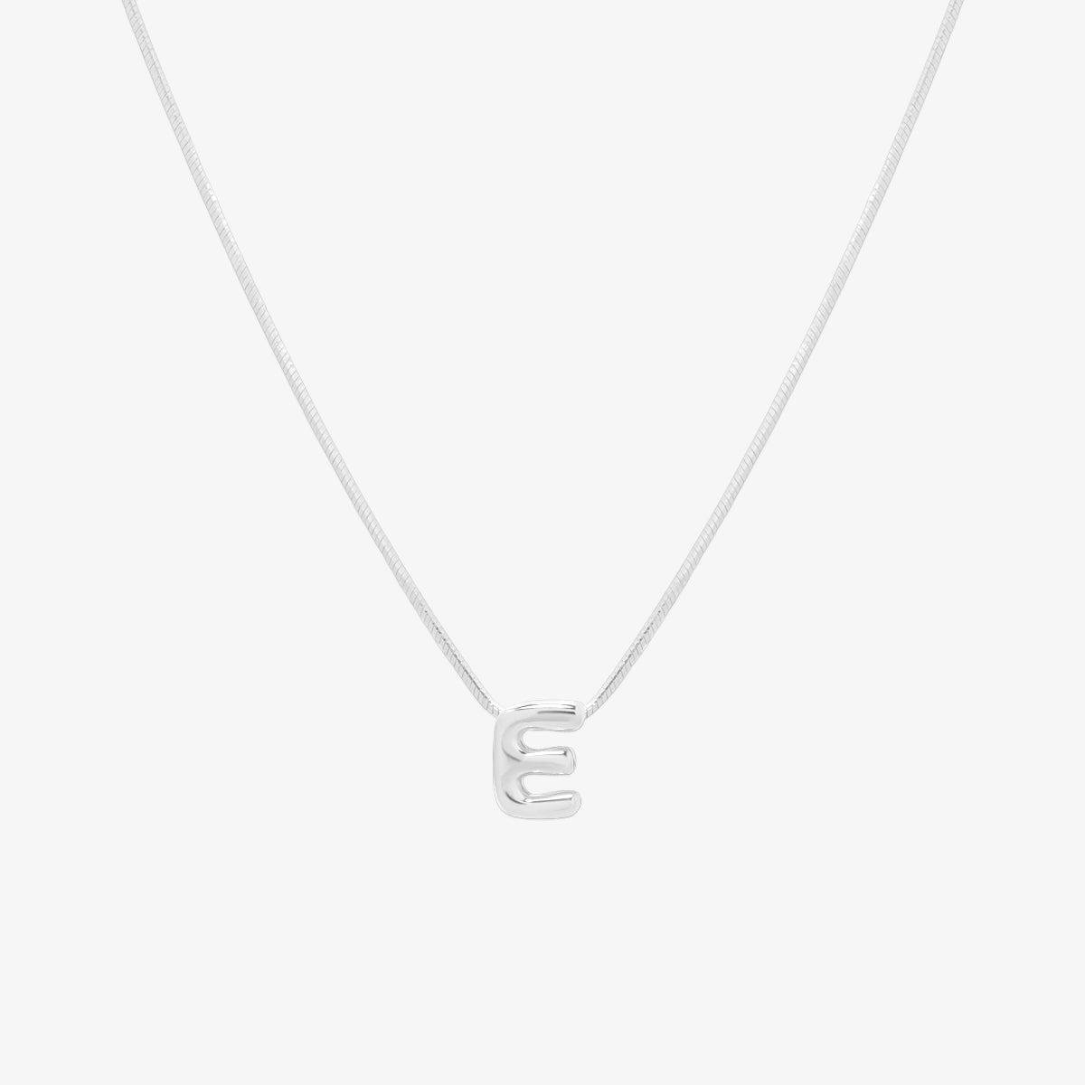 Bubble initial pendant necklace featuring a rounded, playful letter charm on a sleek snake chain, with a smooth and glossy finish.