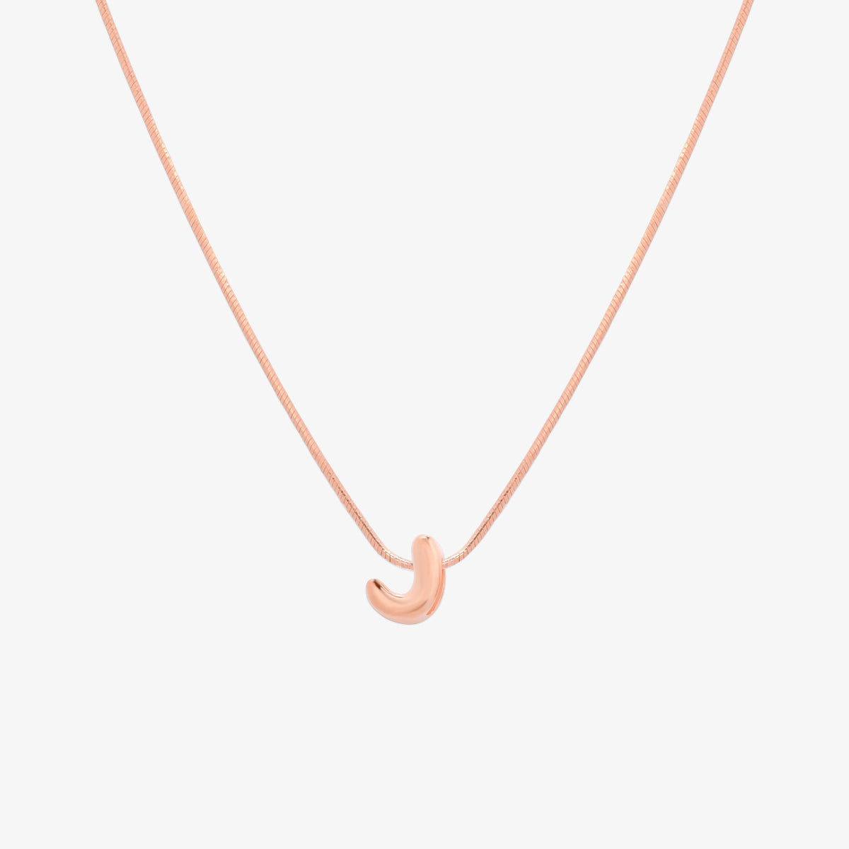 Bubble initial pendant necklace featuring a rounded, playful letter charm on a sleek snake chain, with a smooth and glossy finish.