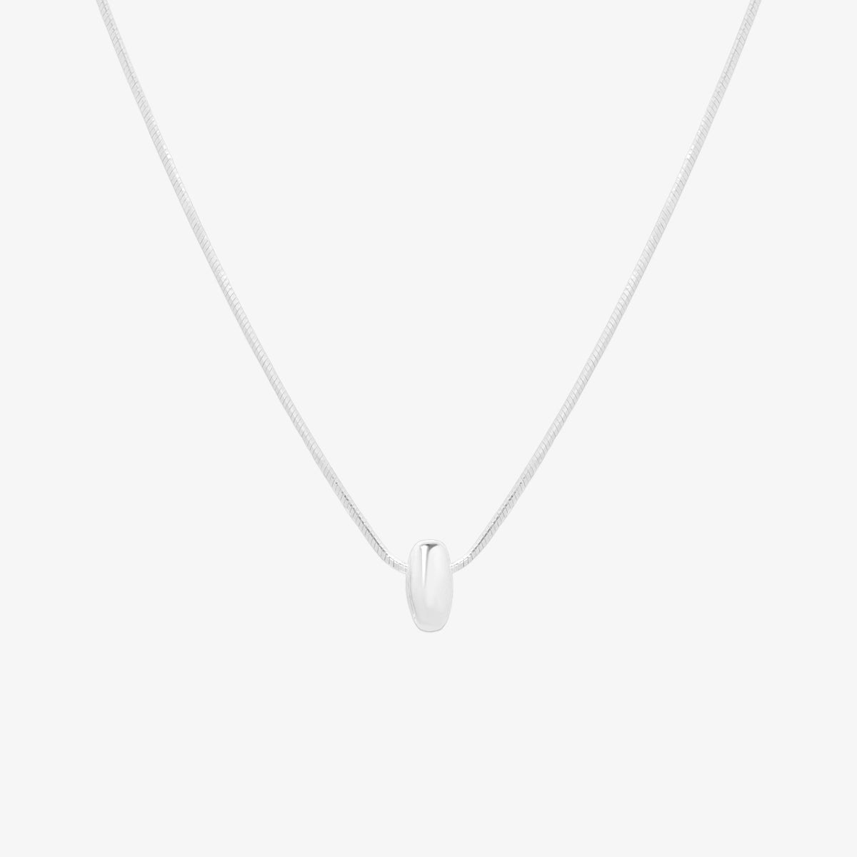 Bubble initial pendant necklace featuring a rounded, playful letter charm on a sleek snake chain, with a smooth and glossy finish.
