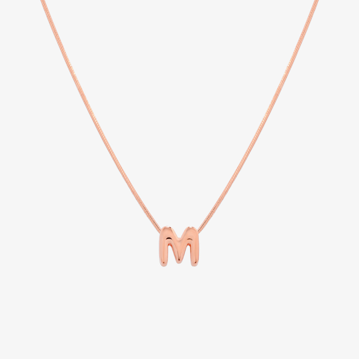 Bubble initial pendant necklace featuring a rounded, playful letter charm on a sleek snake chain, with a smooth and glossy finish.