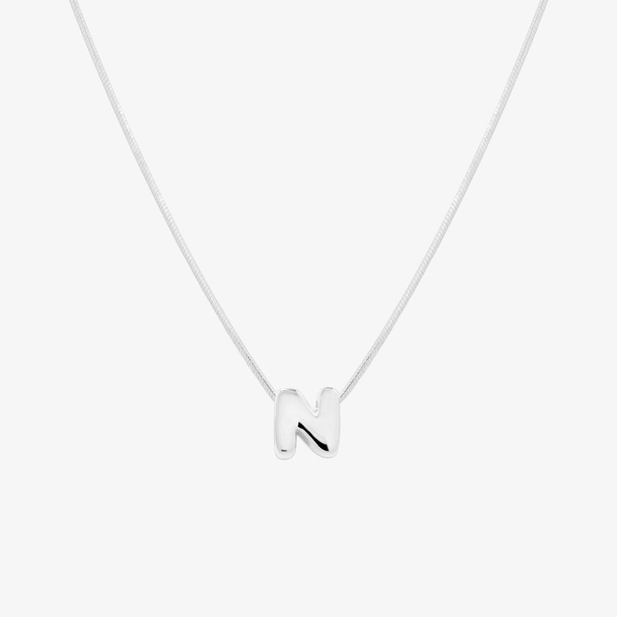 Bubble initial pendant necklace featuring a rounded, playful letter charm on a sleek snake chain, with a smooth and glossy finish.