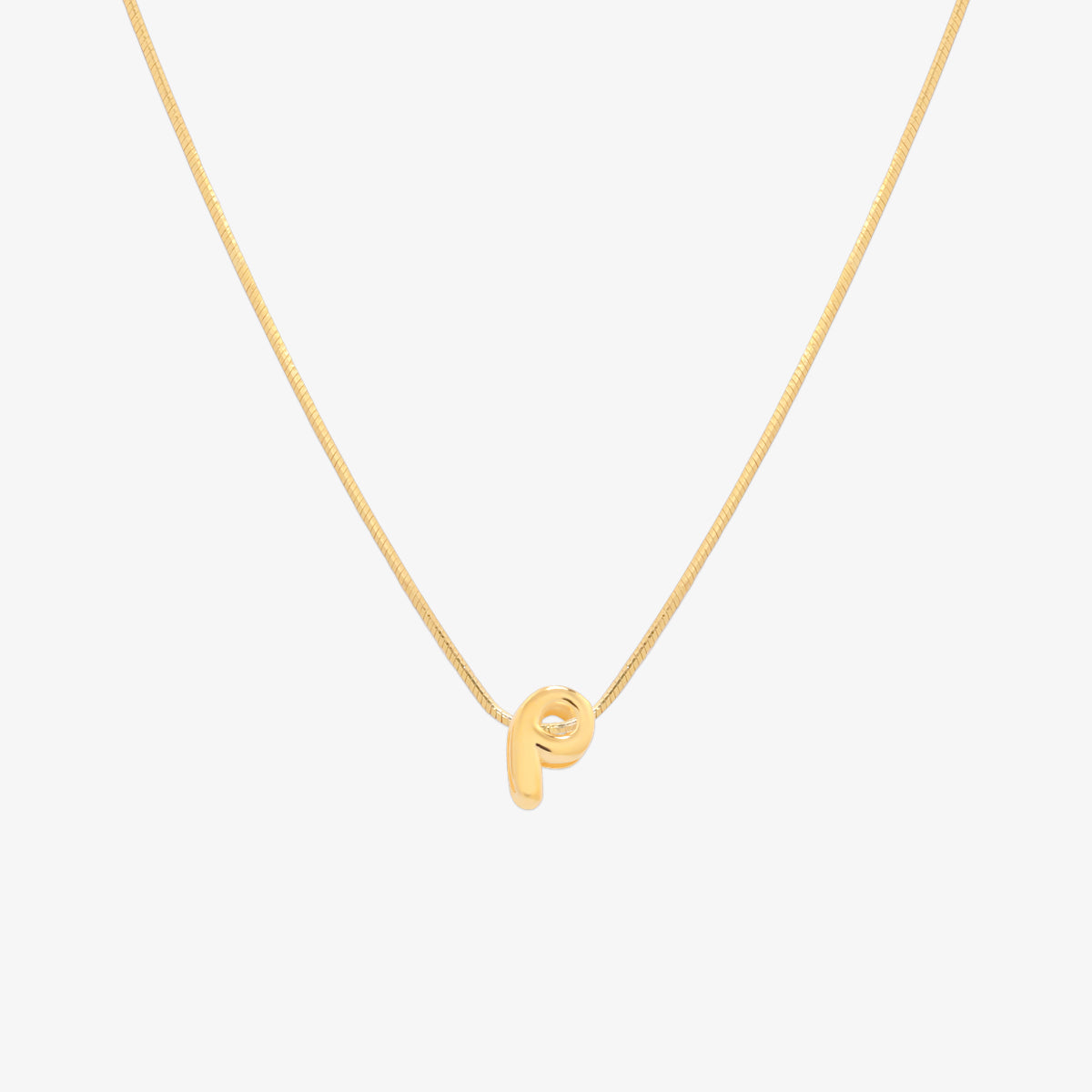 Bubble initial pendant necklace featuring a rounded, playful letter charm on a sleek snake chain, with a smooth and glossy finish.