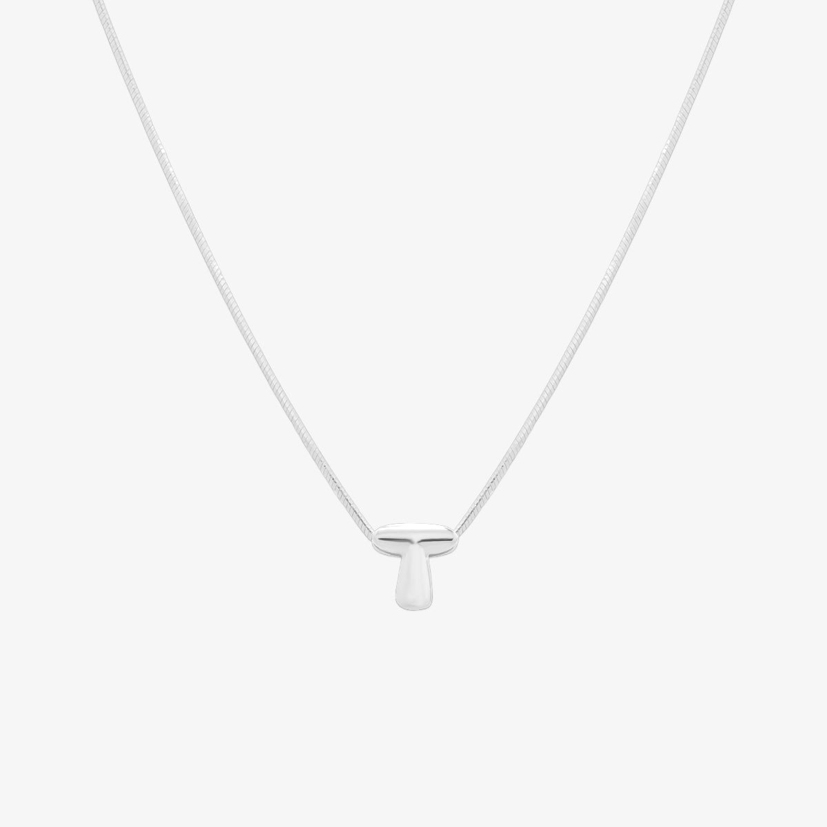 Bubble initial pendant necklace featuring a rounded, playful letter charm on a sleek snake chain, with a smooth and glossy finish.