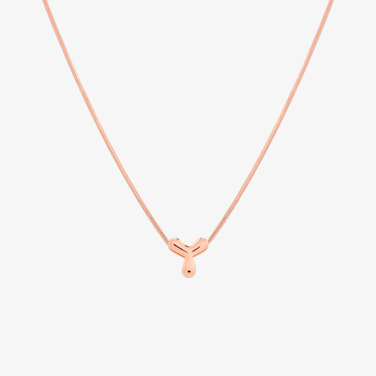 Bubble initial pendant necklace featuring a rounded, playful letter charm on a sleek snake chain, with a smooth and glossy finish.