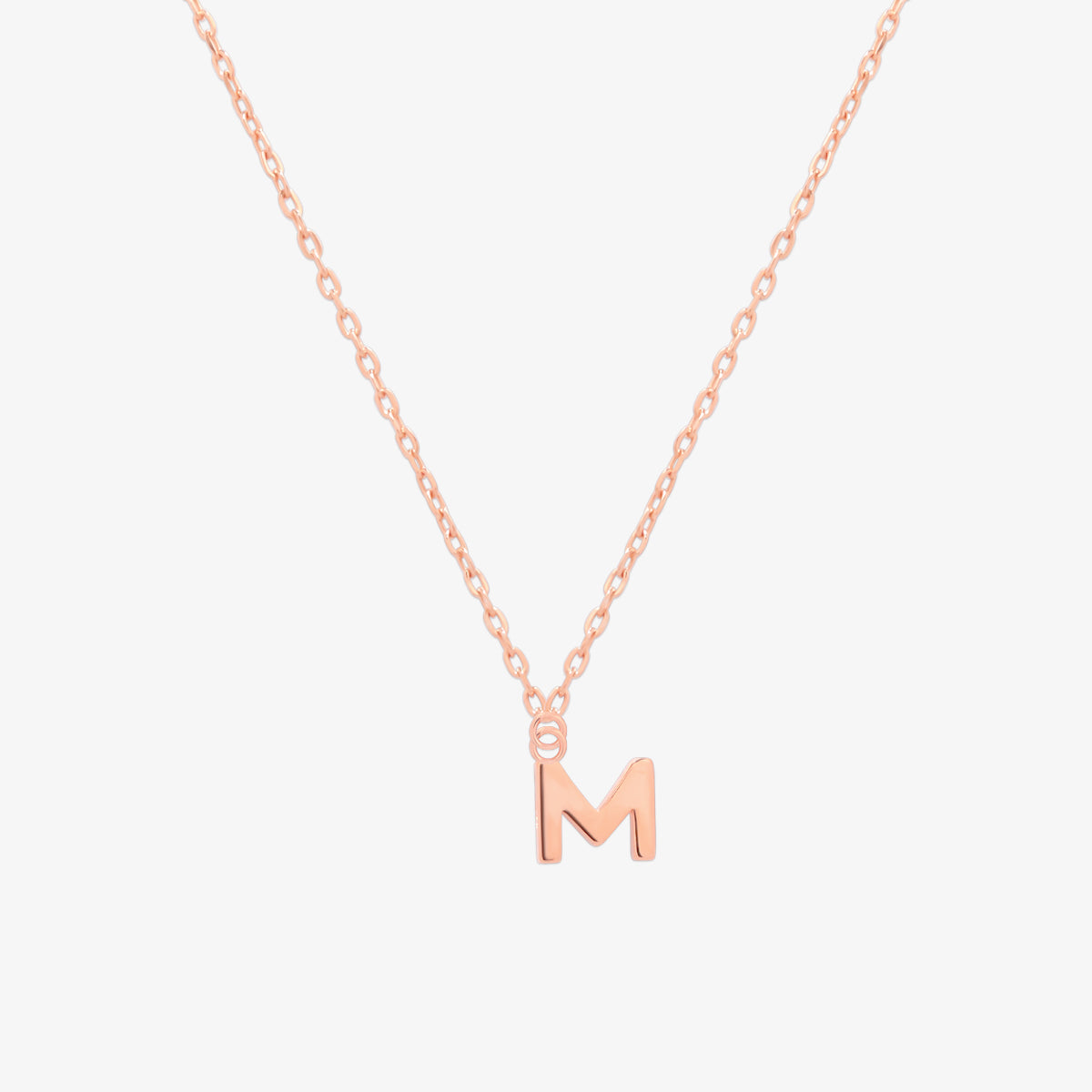 Classic initial pendant necklace featuring a polished letter charm on a delicate chain, showcasing a timeless and elegant design.