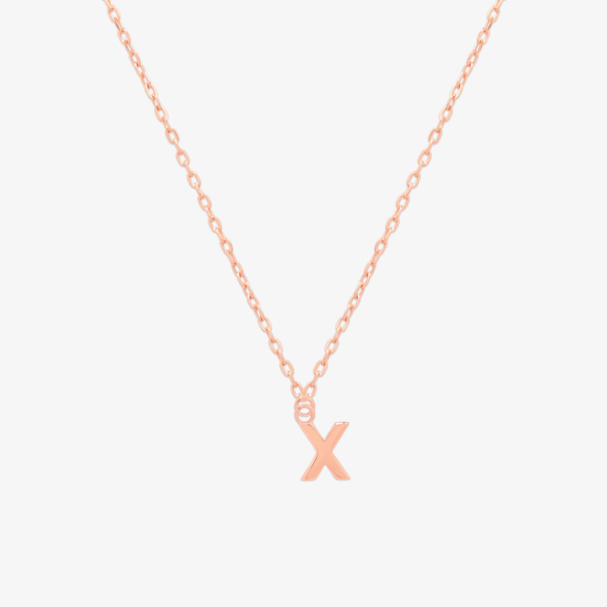 Classic initial pendant necklace featuring a polished letter charm on a delicate chain, showcasing a timeless and elegant design.