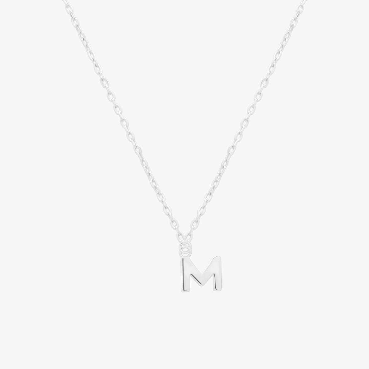 Classic initial pendant necklace featuring a polished letter charm on a delicate chain, showcasing a timeless and elegant design.