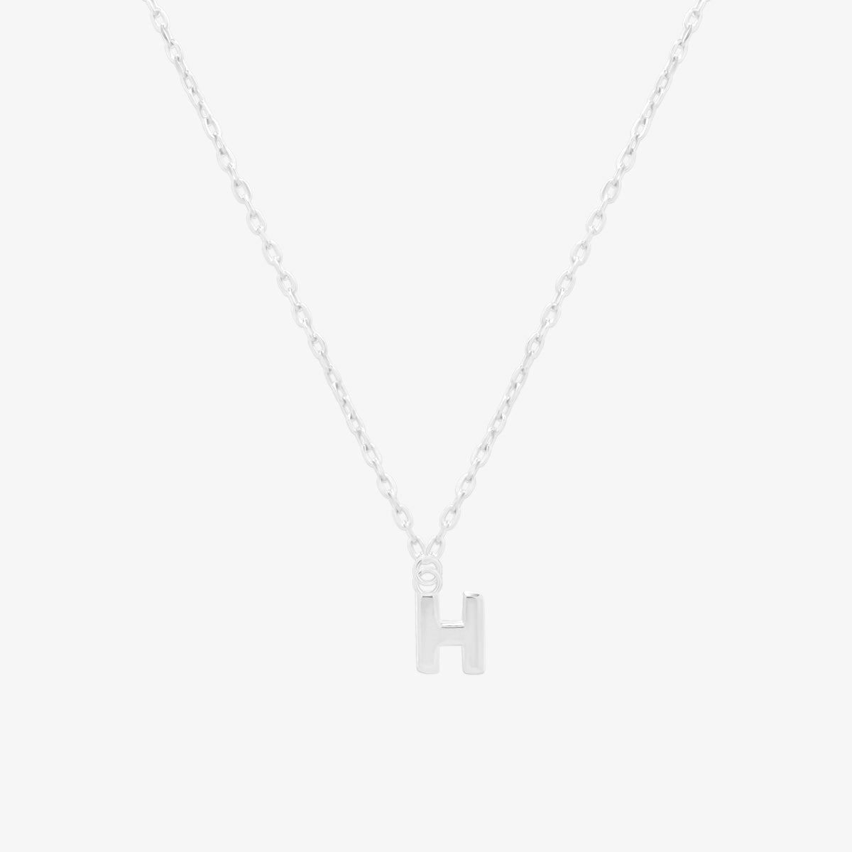 Classic initial pendant necklace featuring a polished letter charm on a delicate chain, showcasing a timeless and elegant design.