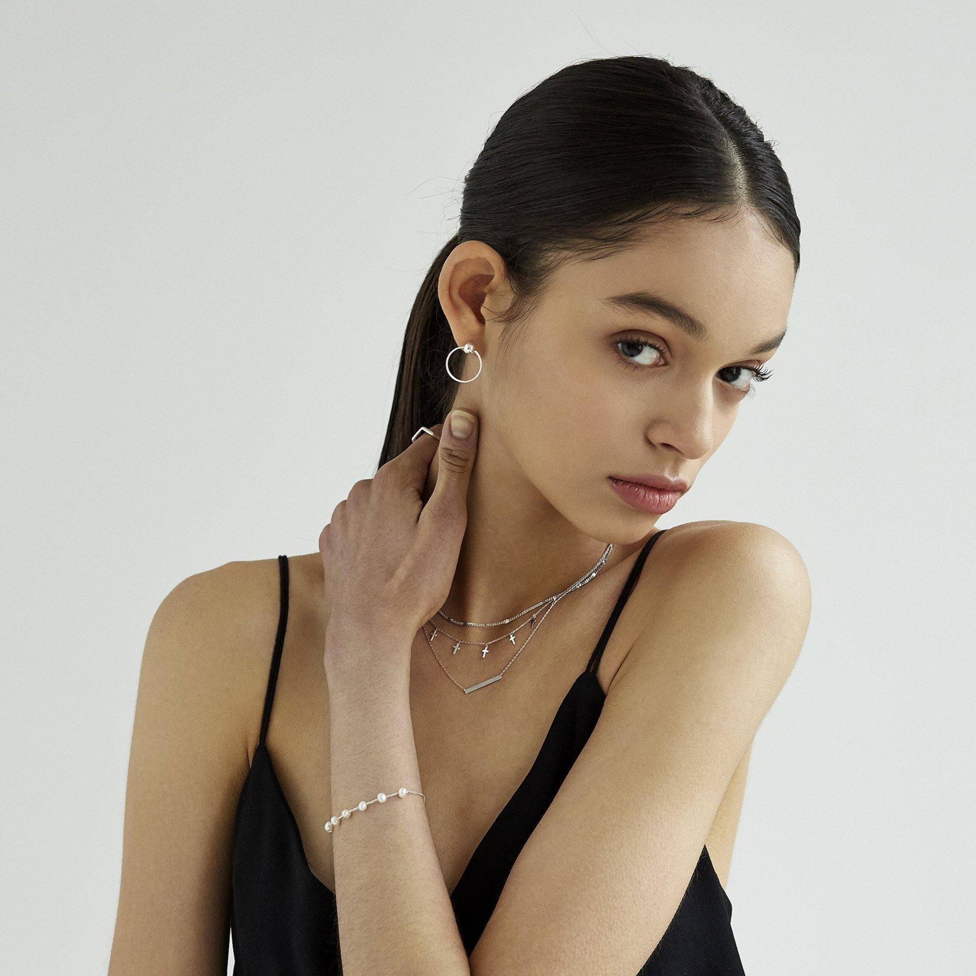 Ball with Line Circle Earrings featuring a modern geometric design with a delicate ball and sleek line detail, offering minimalist elegance and everyday versatility.