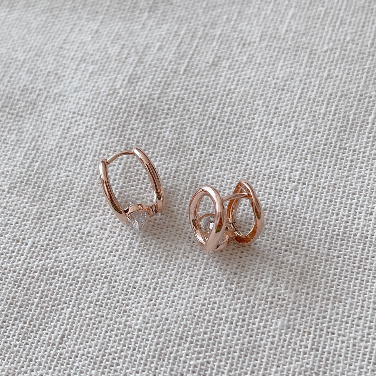 Cubic oval huggie earrings