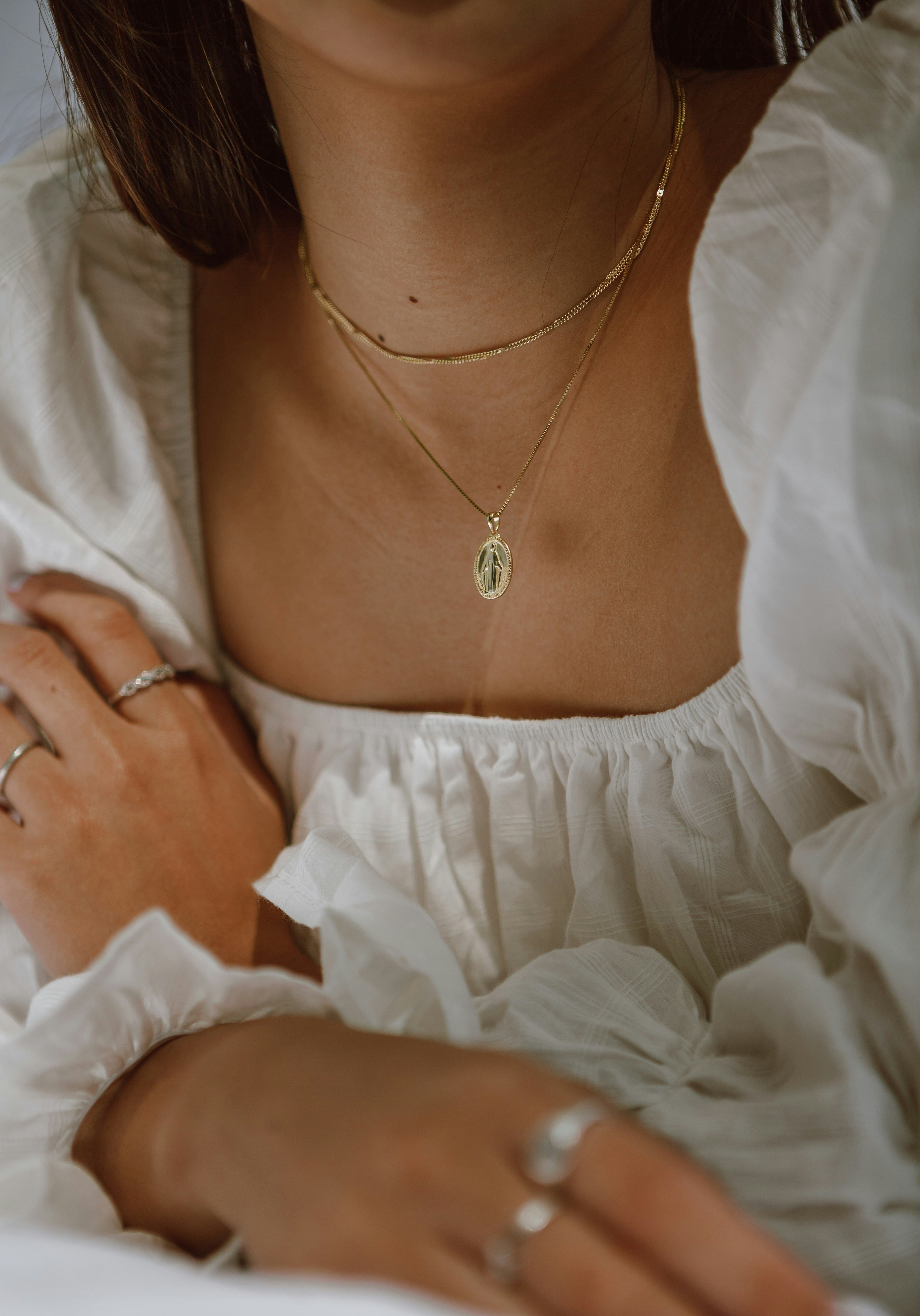 woman with necklace around neck