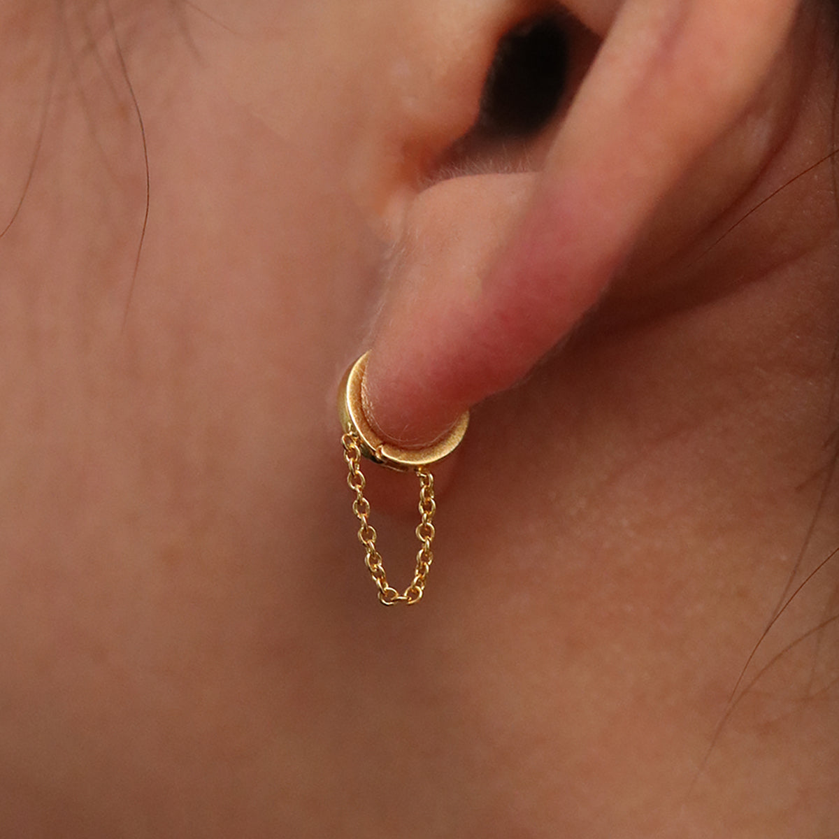 Chain drop huggie earring