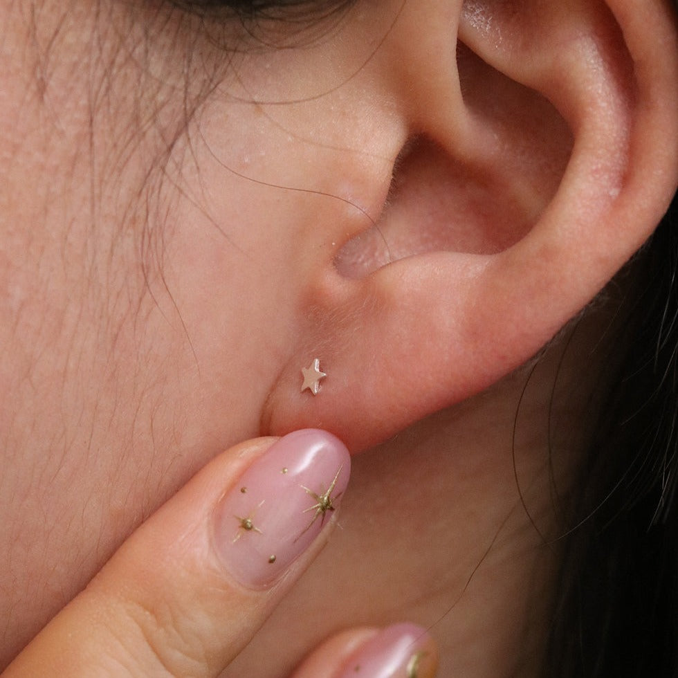 Tiny star stud earrings