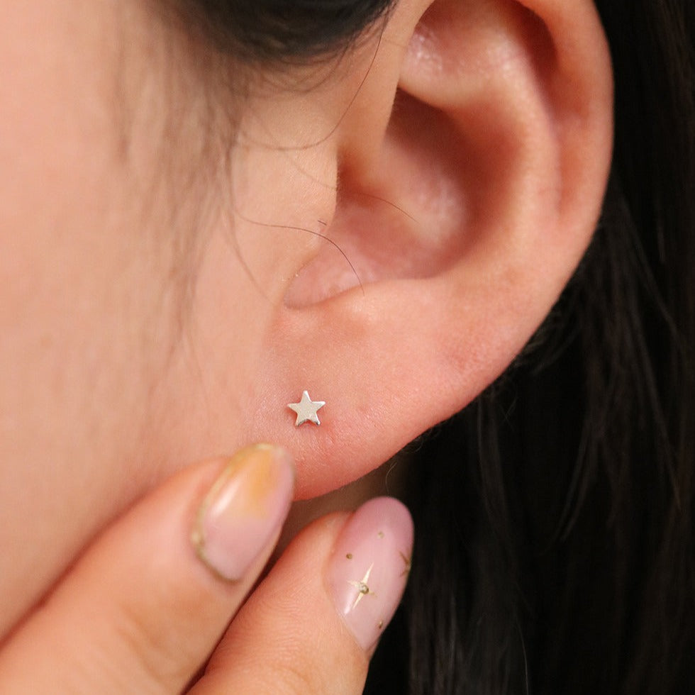 Tiny star stud earrings