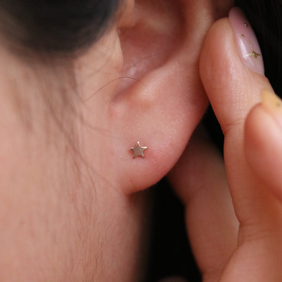 Tiny star stud earrings