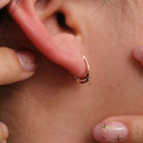 Sleek curved huggie earrings