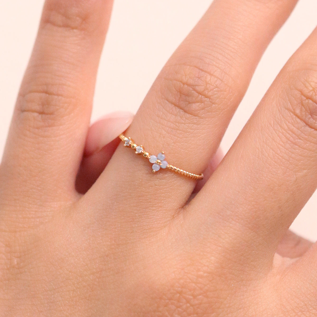 Moonstone Cubic Flower Ring handcrafted with a glowing moonstone centre and delicate cubic flower petals, blending natural beauty.