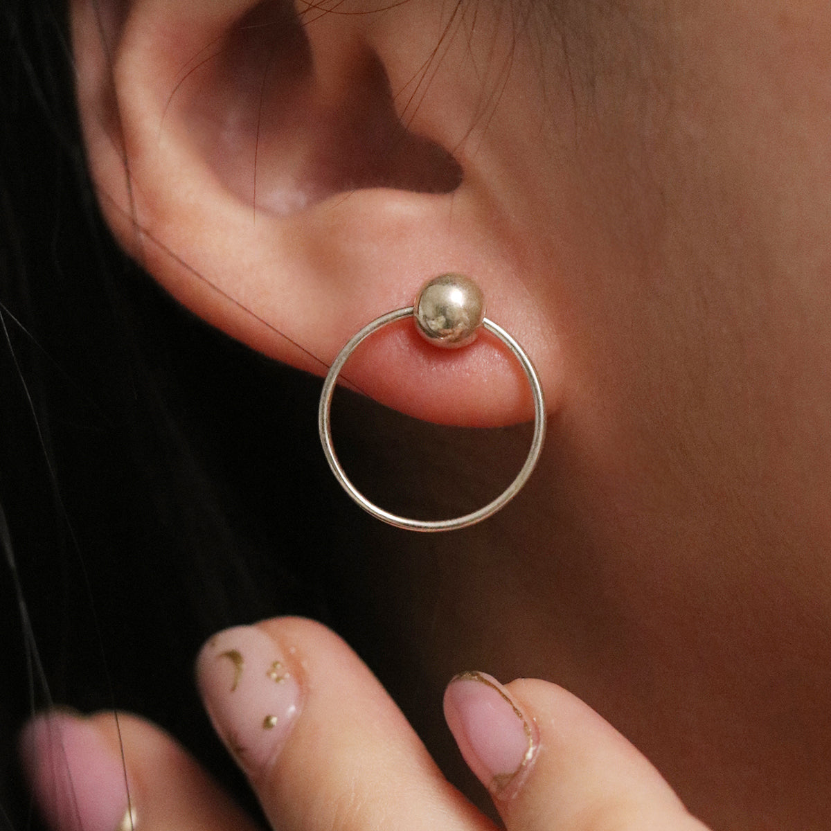 Ball with Line Circle Earrings featuring a modern geometric design with a delicate ball and sleek line detail, offering minimalist elegance and everyday versatility.