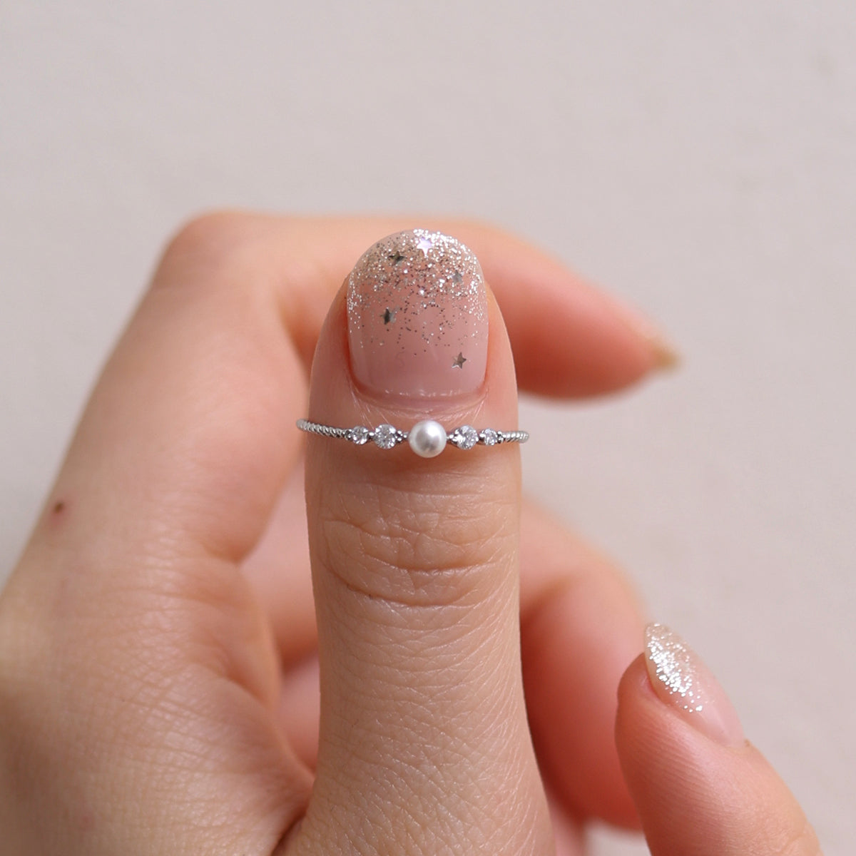 Pearl Cubic Ring featuring high-quality freshwater pearls in a unique cubic design, offering timeless elegance and sophisticated style for any occasion.