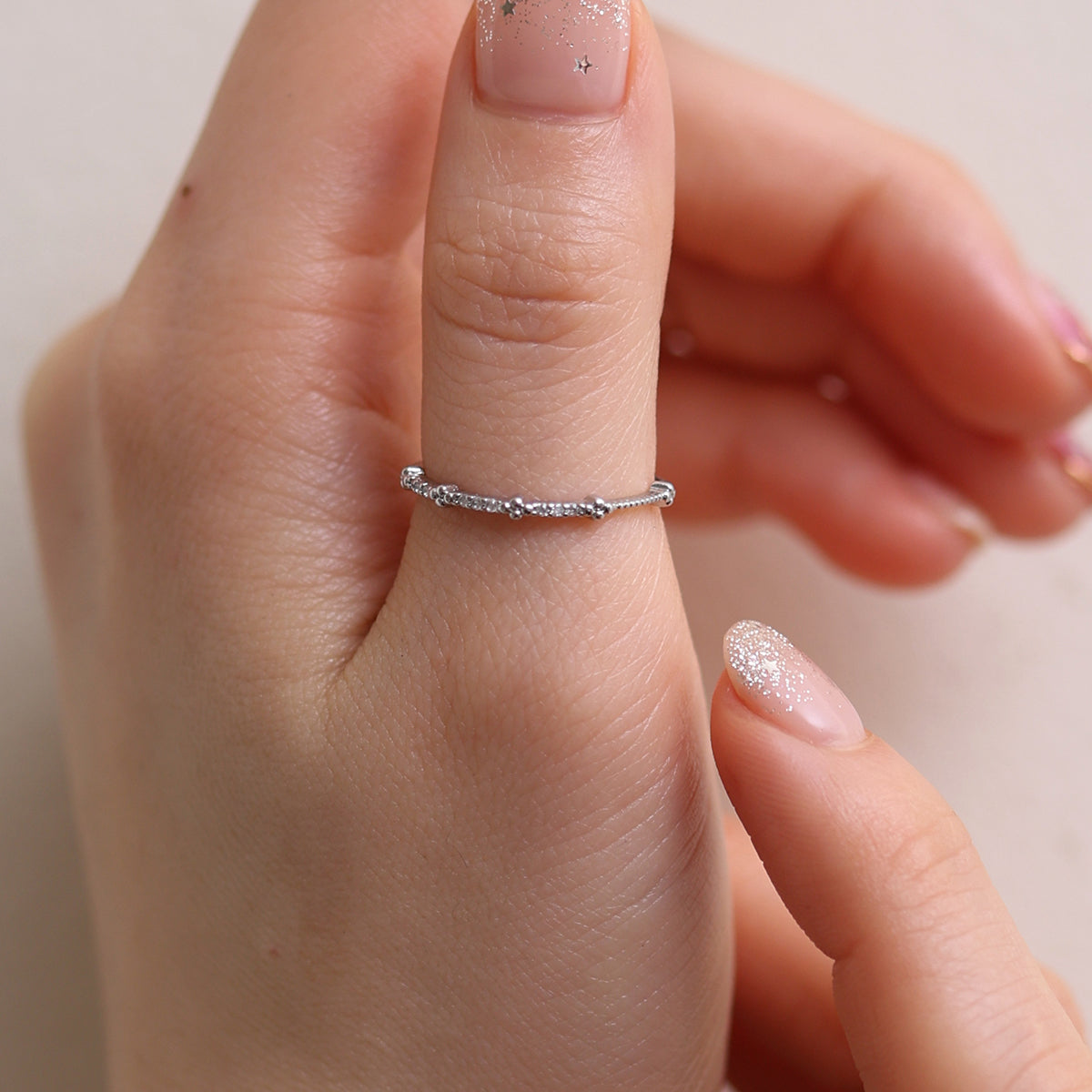 Simple Line Cubic Ring featuring a minimalist band with a single cubic zirconia, offering a sleek and elegant touch to any outfit.