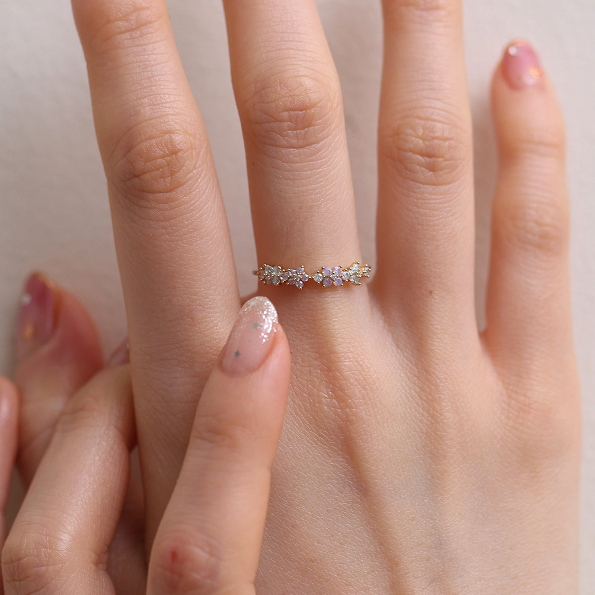 Moonstone Flower Ring featuring a radiant moonstone centre and delicate floral design, crafted from high-quality materials for a touch of timeless elegance.