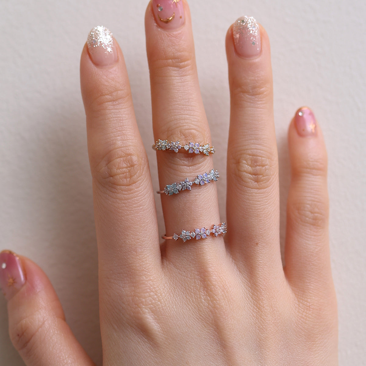 Moonstone Flower Ring featuring a radiant moonstone centre and delicate floral design, crafted from high-quality materials for a touch of timeless elegance.