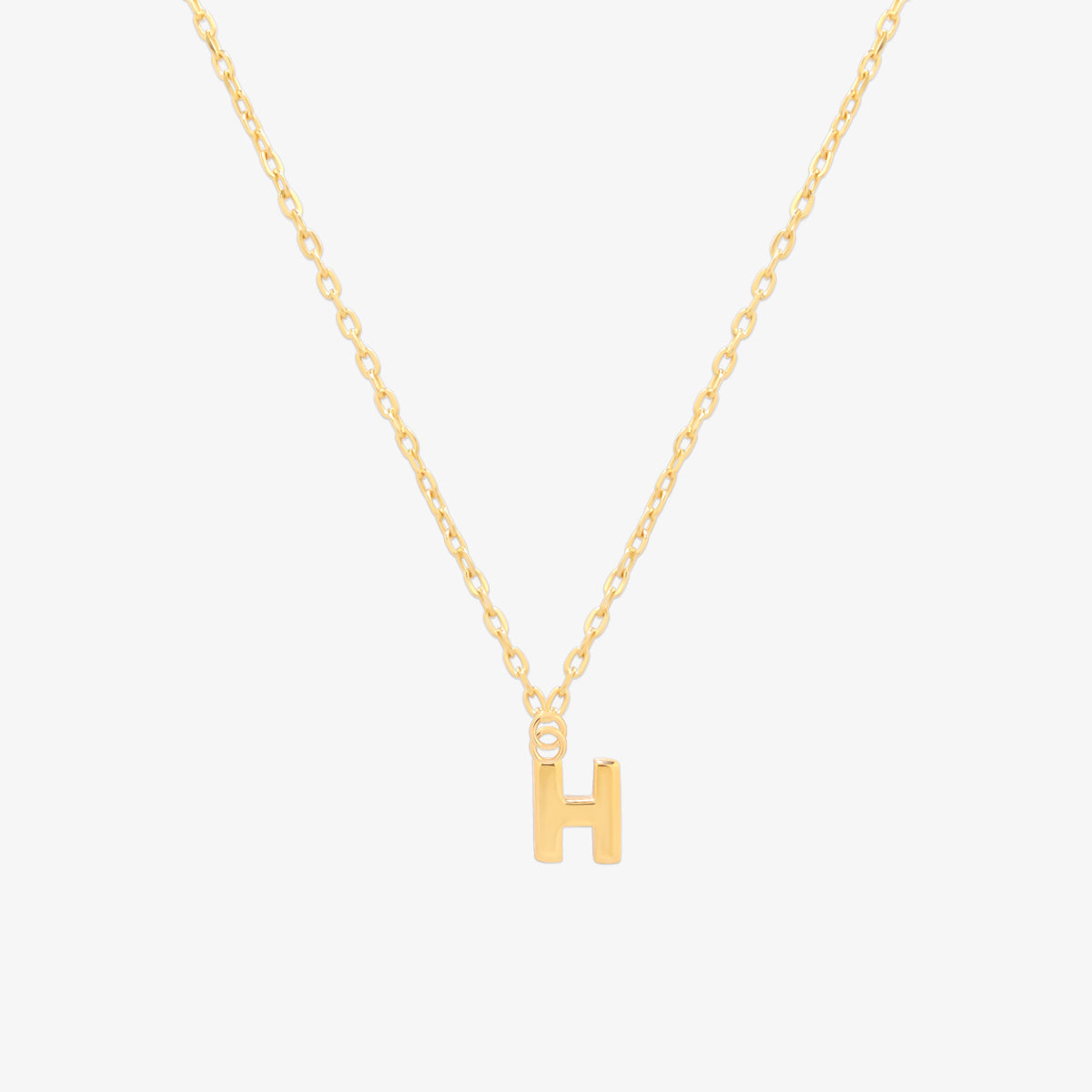 Classic initial pendant necklace featuring a polished letter charm on a delicate chain, showcasing a timeless and elegant design.