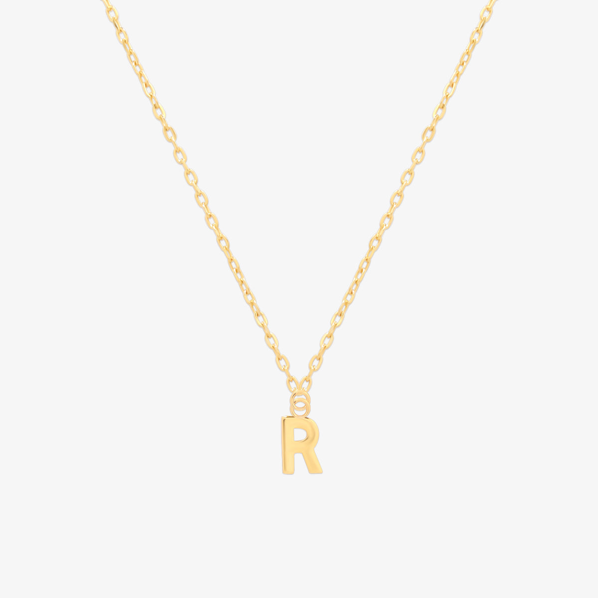 Classic initial pendant necklace featuring a polished letter charm on a delicate chain, showcasing a timeless and elegant design.
