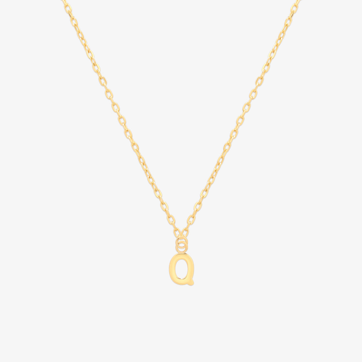 Classic initial pendant necklace featuring a polished letter charm on a delicate chain, showcasing a timeless and elegant design.
