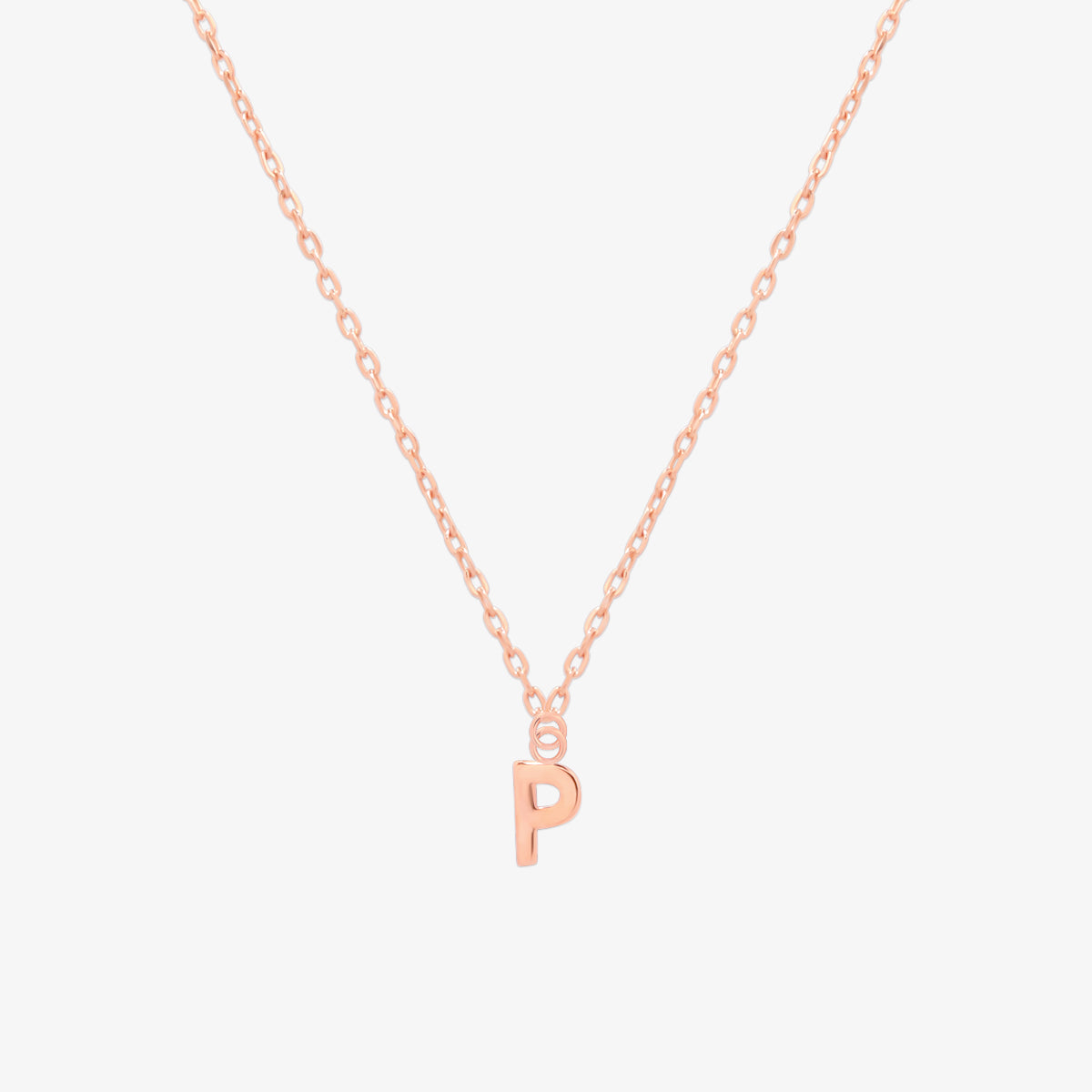 Classic initial pendant necklace featuring a polished letter charm on a delicate chain, showcasing a timeless and elegant design.