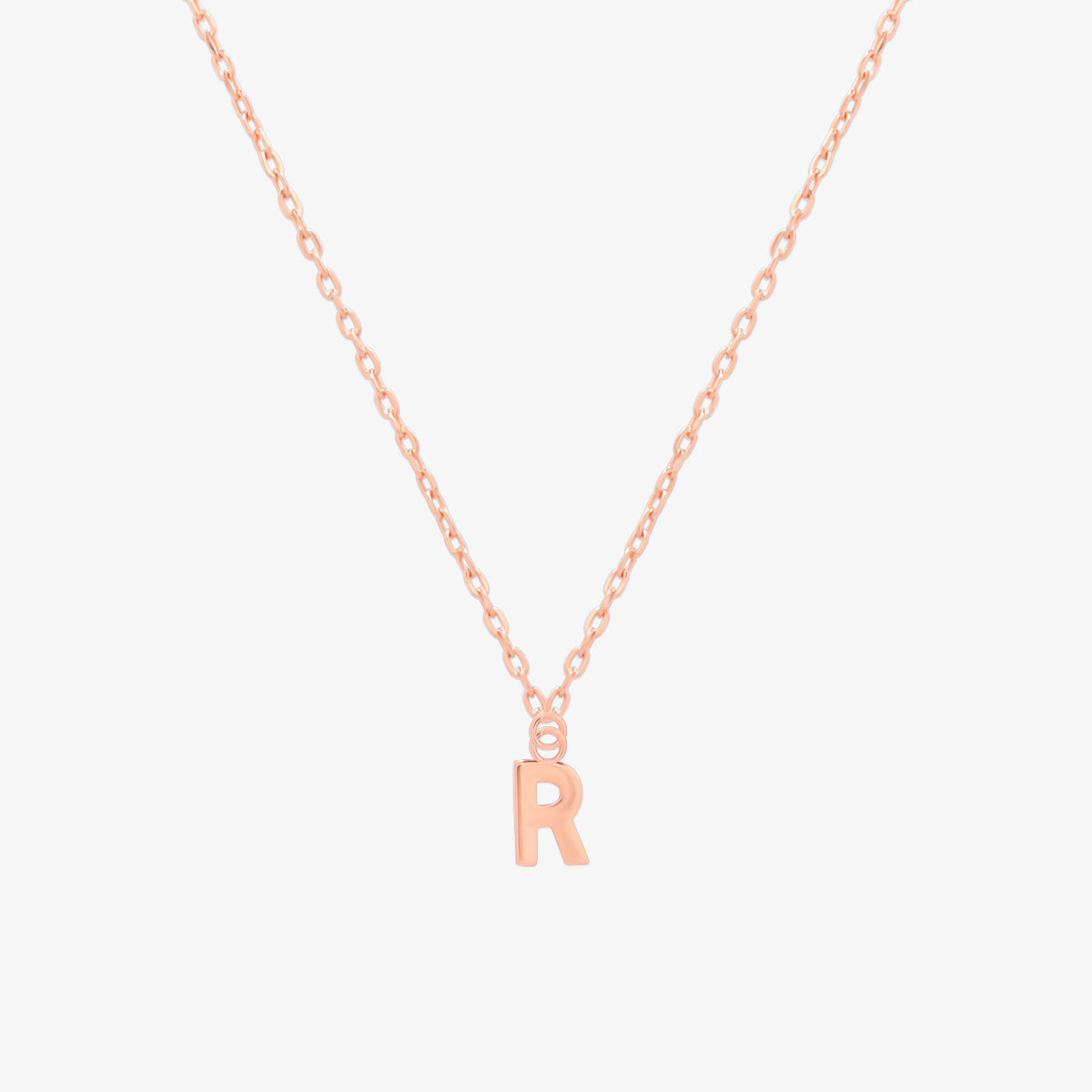 Classic initial pendant necklace featuring a polished letter charm on a delicate chain, showcasing a timeless and elegant design.