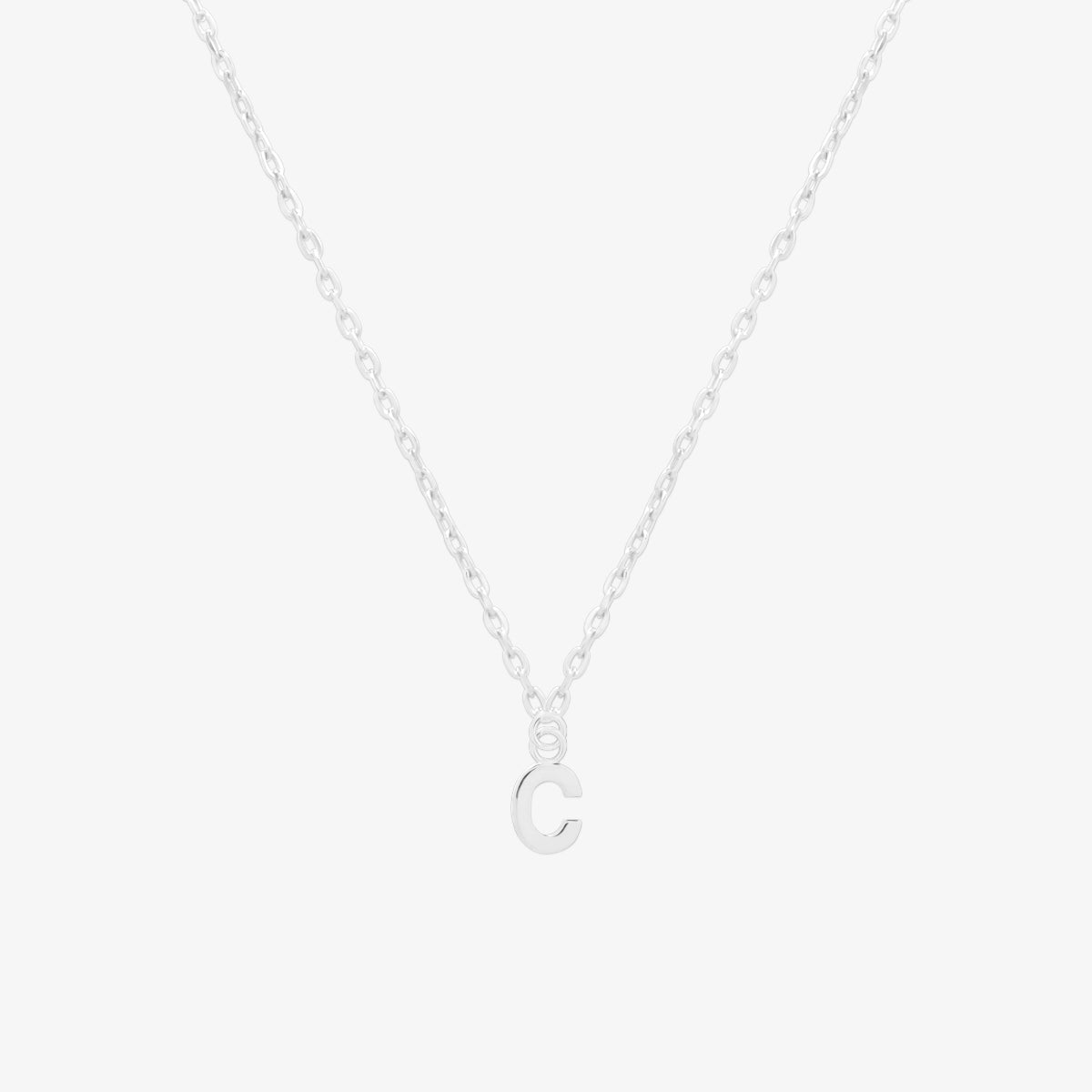 Classic initial pendant necklace featuring a polished letter charm on a delicate chain, showcasing a timeless and elegant design.