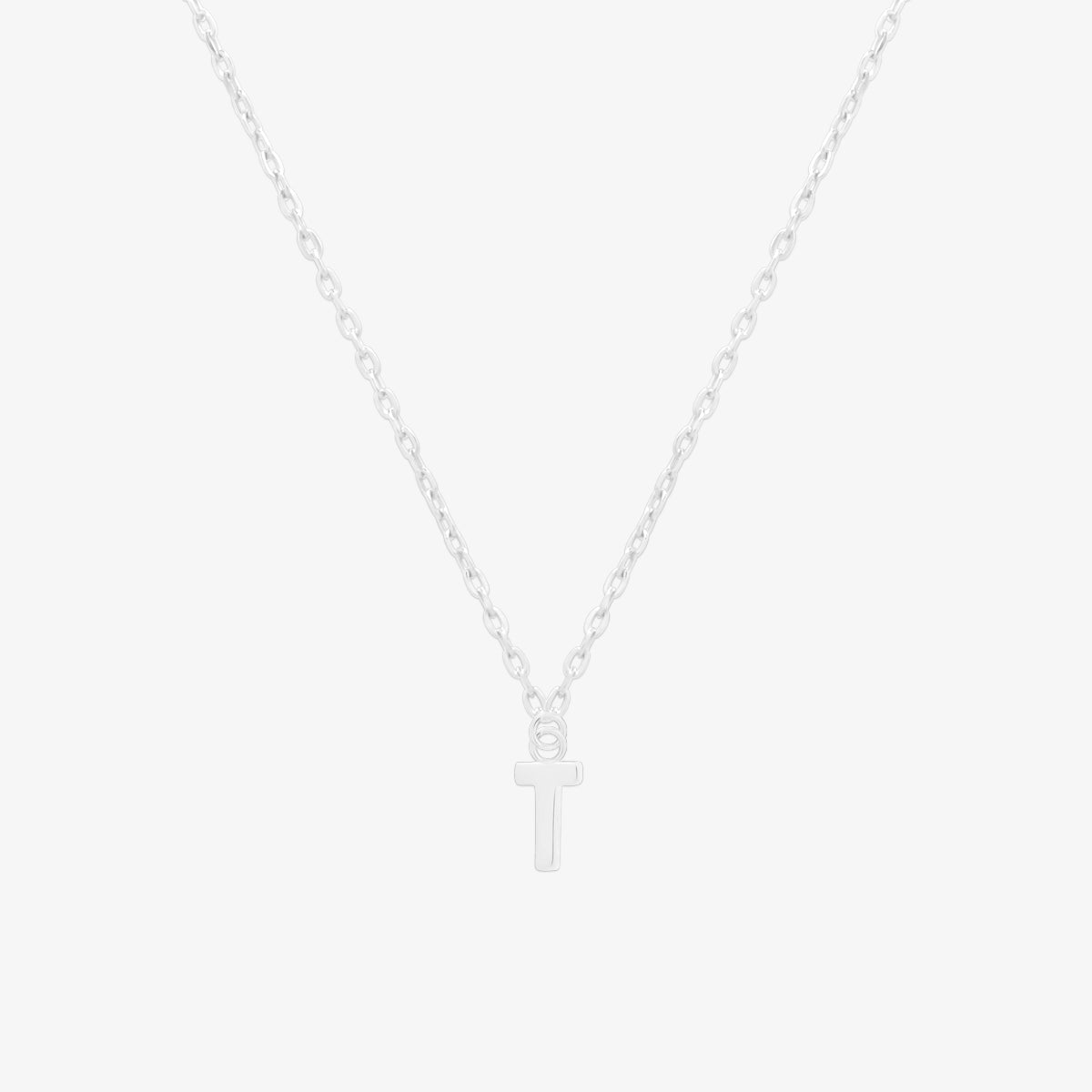 Classic initial pendant necklace featuring a polished letter charm on a delicate chain, showcasing a timeless and elegant design.