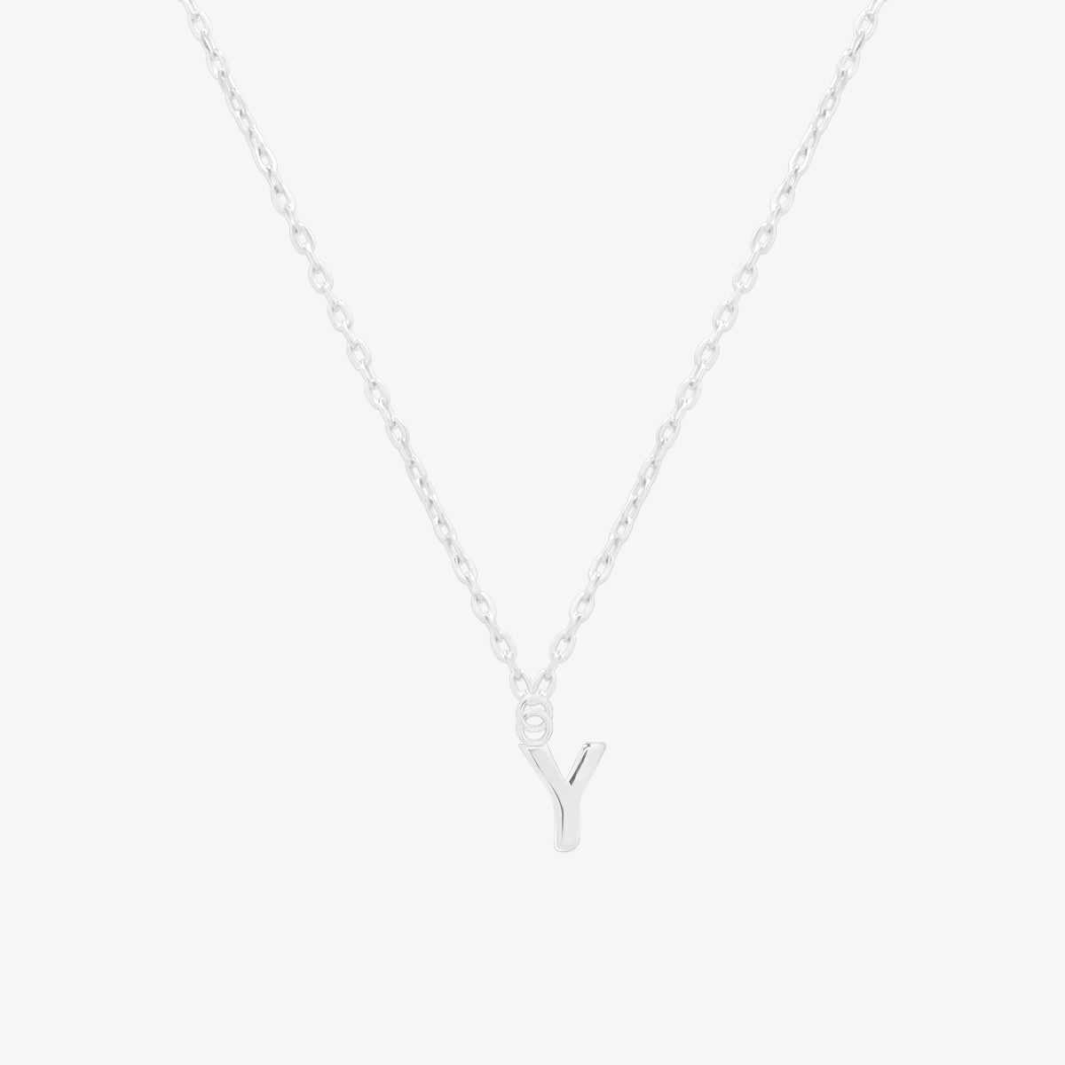Classic initial pendant necklace featuring a polished letter charm on a delicate chain, showcasing a timeless and elegant design.