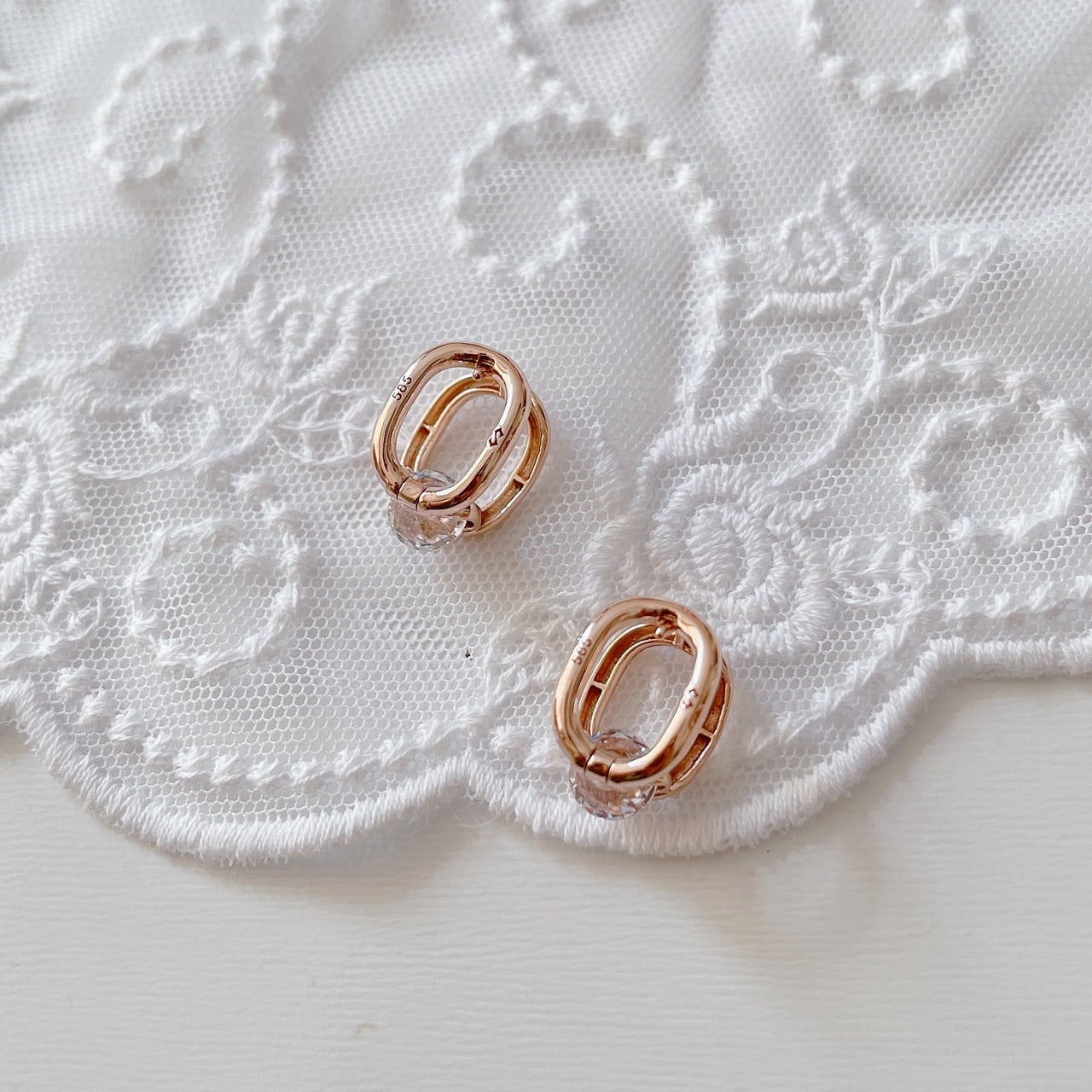 Cubic oval huggie earrings